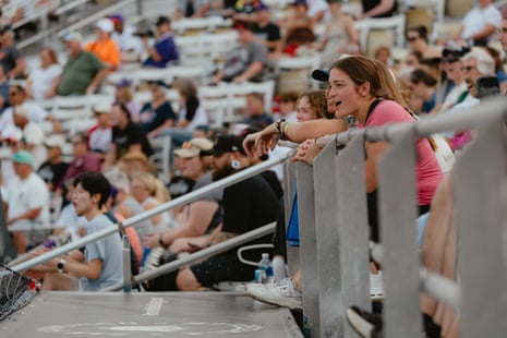 People watch a baseball game