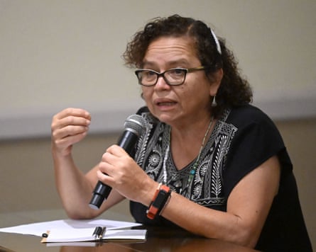 Salvadoran feminist leader Morena Herrera speaks into a microphone.