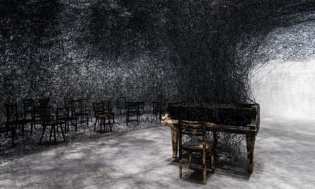 In Silence (2002/2019), burnt piano, burnt chairs, Alcantara black thread.