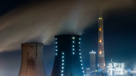 Large cooling towers seen at night