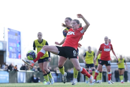 Emma Bissell of Charlton Athletic is challenged by Nicole Barrett of Oxford United.