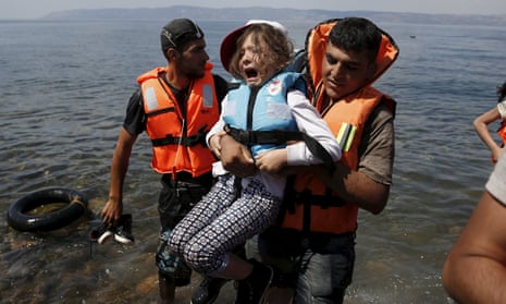 A Syrian refugee girl from Kobani is rescued in August from a boat stopping at Lesbos, Greece. 