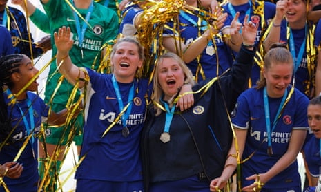Chelsea manager Emma Hayes and Millie Bright lift the trophy as they celebrate winning the league.