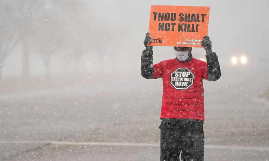 An activist in opposition to the death penalty protests outside the US penitentiary in Terre Haute.