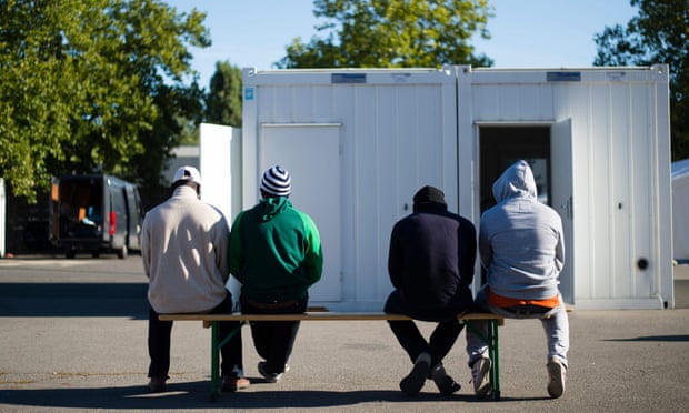 Men wait to be registered in Berlin, which received around 69,000 asylum seekers in the last two years.