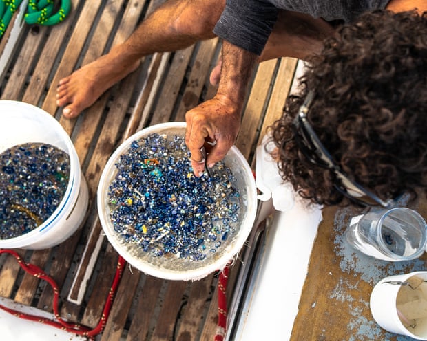 The crew often finds thousands of pieces of plastic daily in the water samples.