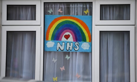 A window with a sign in support of NHS staff