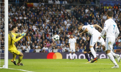 Real Madrid’s Karim Benzema has a point blank header saved by Hugo Lloris of Spurs.