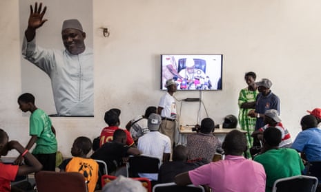 Supporters of Adama Barrow watch provisional results in the Serrekunda neighbourhood of Banjul