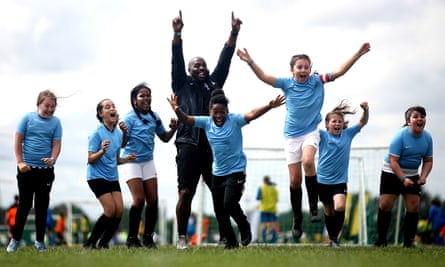 Young women playing soccer in Hackney Marsh.
