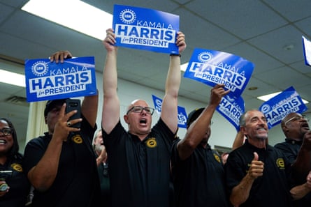 Supporters cheer as Kamala Harris speaks during a campaign rally at UAW Local 900 in Wayne, Michigan, on 8 August.