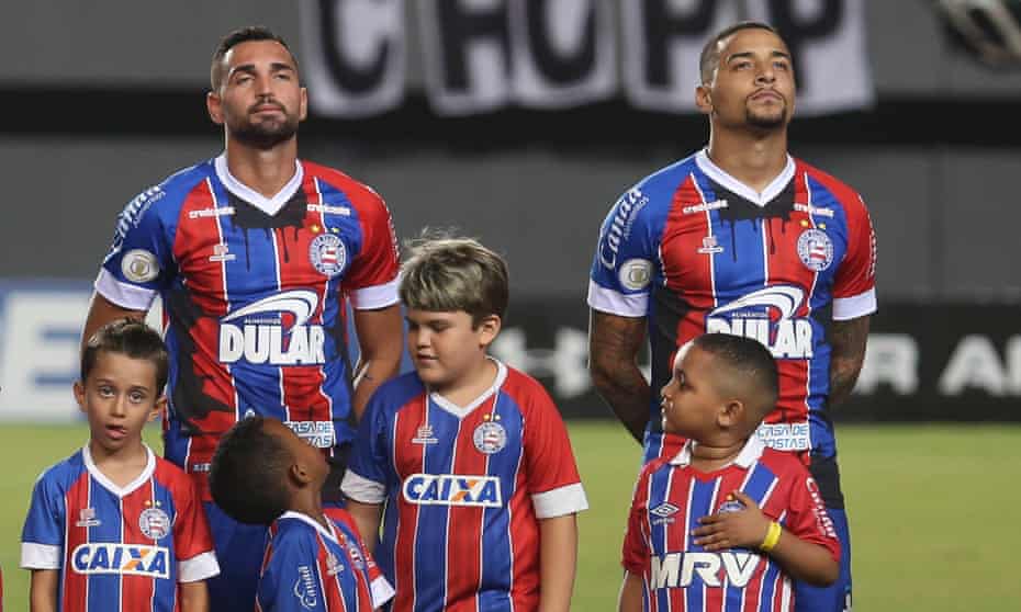 Bahia players wear their oil stained shirts before their league game against Ceara.