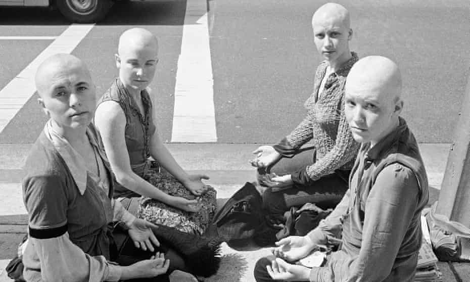 Four young women members of the Charles Manson "family" kneel on the sidewalk outside the Los Angeles at Hall of Justice, March 29, 1971 with their heads shaved. They've kept a vigil at the building throughout the long trial in which Manson and three other women were convicted of slaying actress Sharon Tate and six others. Left to right: Cathy Gillies, Kitty Lutesinger, Sandy Good, Brenda McCann. Jurors were believed near a verdict on the penalty to be imposed on the defendants. (AP Photo/Wally Fong)