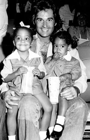 Robert Ellis Silberstein aka Bob Ellis attends a movie with daughters (L) Rhonda and Tracee in 1975 in Los Angeles, California