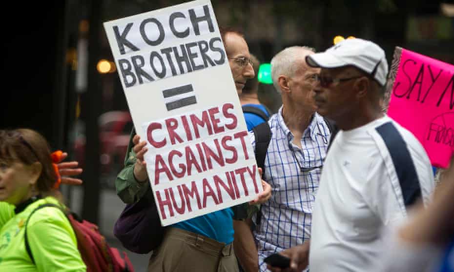 A protester against the Kochs’ influence in 2014. ‘Because personnel is policy, this means Koch often gets the policies – and judges – he wants.’
