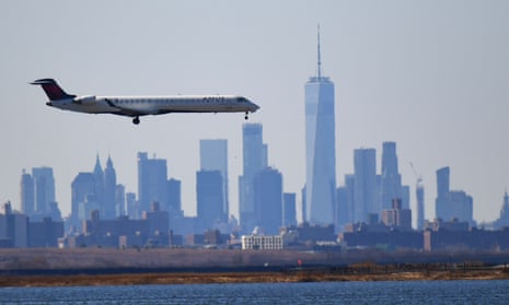 A Delta plane heads to land at JFK airport on 15 March 2020 in New York City. 