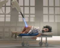 A puppet is shown lying on a hospital trolley with a laser beaming onto his bare backside in a scene from André Is an Idiot.