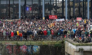 Demonstrators hold banners to protest against the expulsion of the families and farmers from land that would permit the construction of a new airport in Notre-Dame-des-Landes, outside the courthouse in Nantes, France, 13 January 2016.