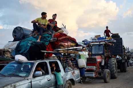Displaced Palestinians, fleeing northern Gaza due to an Israeli military operation, move southward after Israeli forces ordered residents of Gaza City to evacuate.