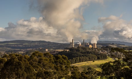 A general view of a power station surrounded by trees and hills
