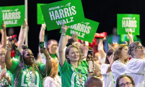 Politics tamfitronics Supporters hold signs as US Democratic vice presidential candidate Tim Walz speaks at the American Federation of State, County and Municipal Employees (AFSCME) 46th International Convention in Los Angeles, California, US, 13 August 2024.