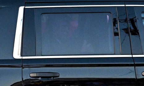 Donald Trump seen through car window as he leaves.