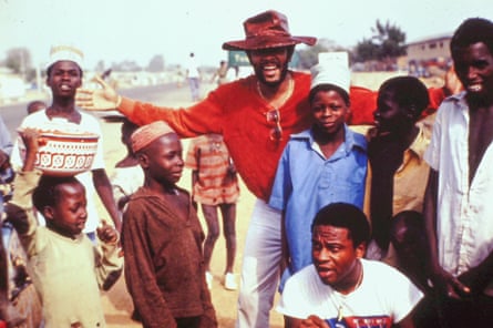 Roy Ayers with children during the tour.