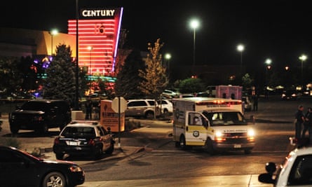 An ambulance is parked outside the Century 16 Theater in the Town Center mall in Aurora, Colorado.