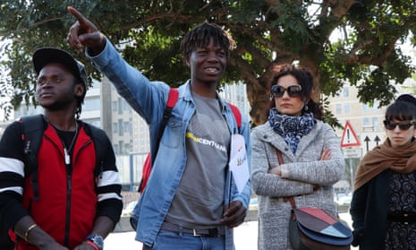 Abubakar Dukuly leads locals on a walking tour around Catania in eastern Sicily