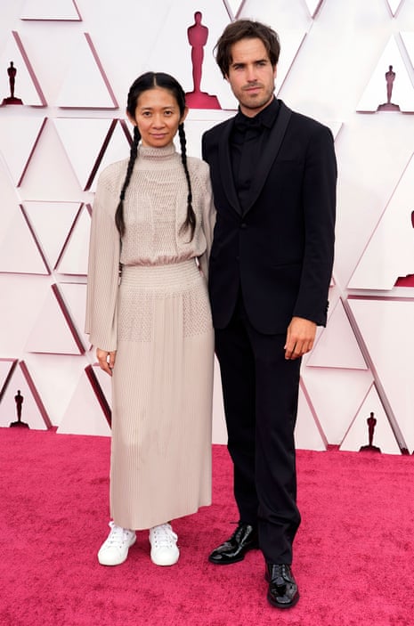Chloe Zhao, left, and Joshua James Richards arrive at the Oscars 93rd Annual Academy Awards, Arrivals, Los Angeles, USA - 25 Apr 2021