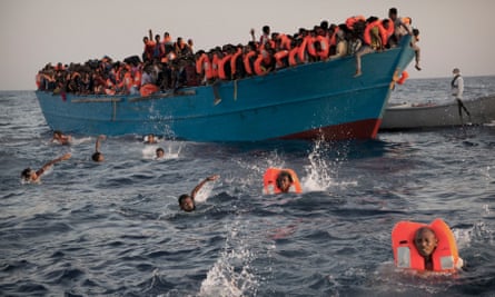 Migrants being rescued as they try to cross the Mediterranean sea from north Africa to Europe