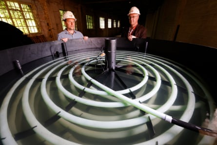 Dr Andrew Fraser Harris and Professor Christopher McDermott with the SeaWarm system – layers of looped tubing carrying the glycol, which transfers the warmth of the water to the heat pump.