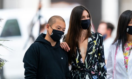Designer Jason Wu (left) with American model Jacquelyn Jablonski as he prepares to open New York fashion week with a scaled-down rooftop catwalk for 30 people.