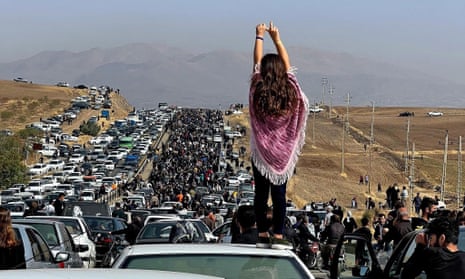 A demonstrator defies the crackdown last year on peaceful protests led by women in Iran.