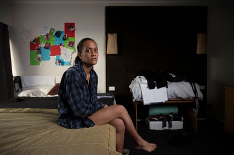 Kristina Reid sits on a bed in her room at the Four Canoes Motel in Rotorua, New Zealand