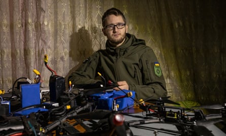 Bohdan Voisekhovskyi, deputy head of a volunteer unit fighting near Kupiansk, is surrounded by drone equipment.