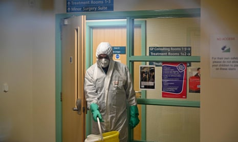 A worker in protective clothing inside the County Oak medical centre in Brighton.