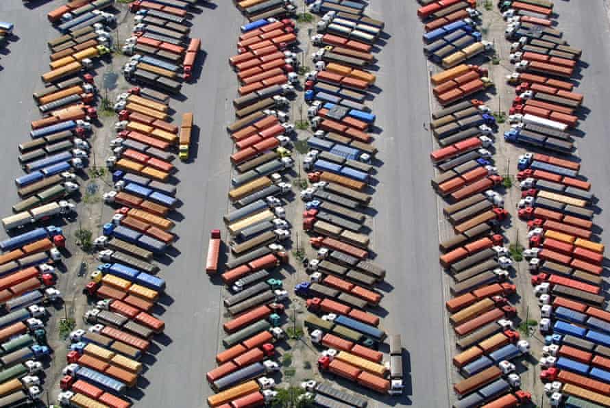 Hundreds of trucks stand idle as they wait to unload their cargo of soya,epa00158630 Hundreds of trucks stand idle as they wait to unload their cargo of soya, the trucks are stranded due to a strike at Paranagua Harbour, Brazil , Monday 22 March 2004. Most of the vehicles remain in the harbour parking area during the fourth strike day, at Sao Jose dos Pinhais, Brazil. Monday 22 March 2004. EPA/ALBARI ROSA BRAZIL OUT