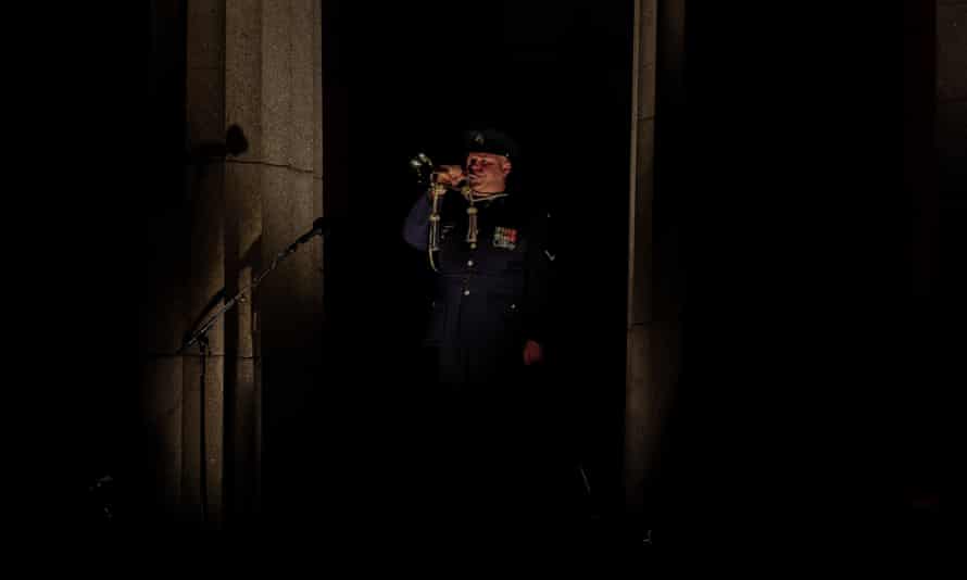 A member of the defence forces plays the last post on The Shrine of Remembrance on April 25, 2022 in Melbourne, Australia.(Photo by Asanka Ratnayake/Getty Images)