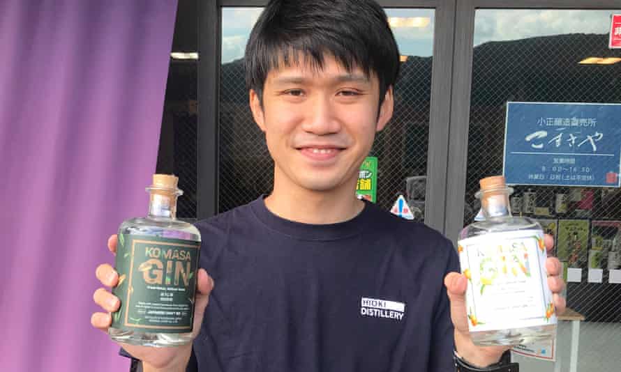 Ryota Mityamae shows off two of the gins made by the Komasa Jozo distillery in Kagoshima, Japan.