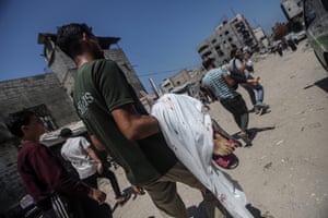 Palestinians, including children, who lost their lives, are brought to al-Shifa hospital for funeral procedures after an Israeli military attack in Gaza City