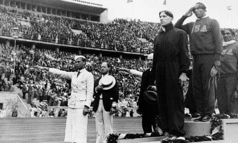 Jesse Owens, second right, at the medal ceremony of the 100-metre final at the 1936 Olympic Games in Berlin.