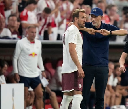 Bayern Munich’s head coach Thomas Tuchel talks to Harry Kane during the German Super Cup final