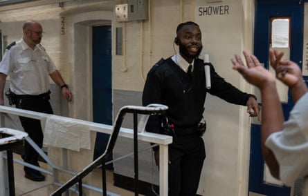 Chibs Ekeiwu calms a prisoner