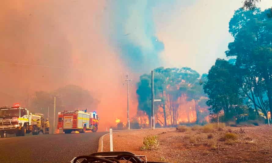 Firefighters attend a blaze at Wooroloo, near Perth, Australia