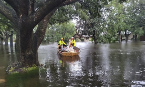 In this photo provided by the Orange County Fire Rescue's Public Information Office, firefighters in Orange County, Fla., help people stranded by Hurricane Ian early Thursday, Sept. 29, 2022.