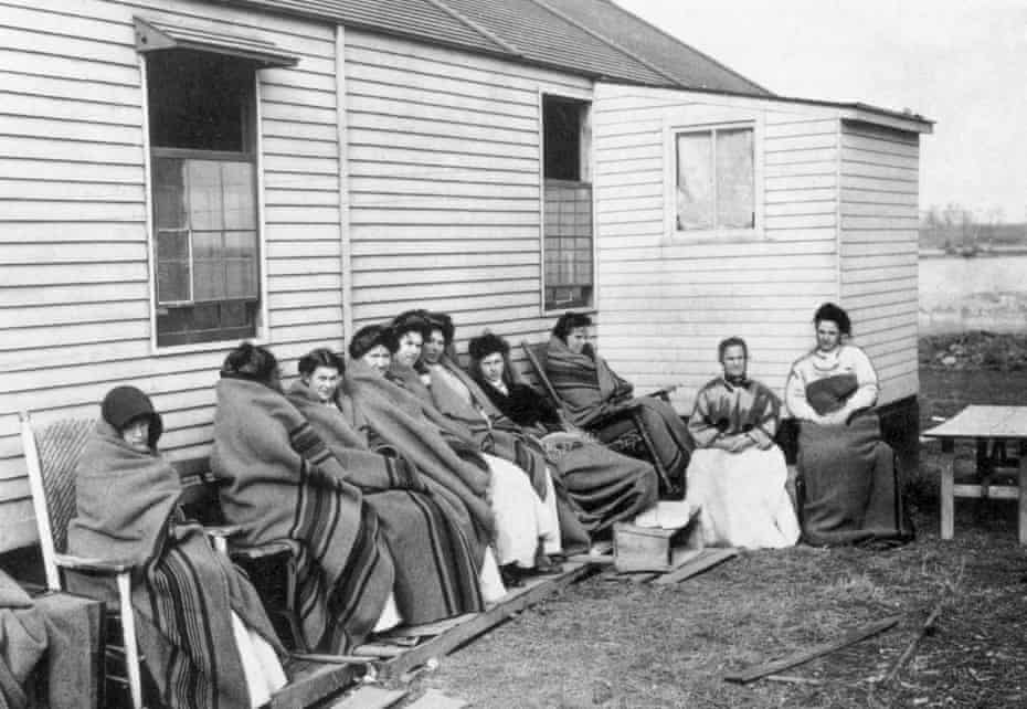 Mary Mallon, better known as Typhoid Mary, sits fourth from right among a group of inmates quarantined on an isolated island on the Long Island Sound. 