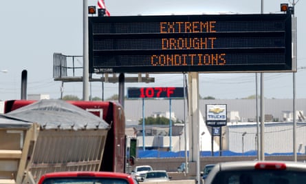 A highway sign and a retail sign detail the current drought and extreme temperatures currently plaguing the southwest U.S. in Fort Worth, Texas August 5, 2011.