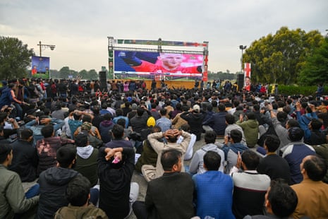 Cricket fans watch action on a big screen at a park in Islamabad.