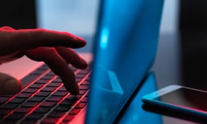 Man typing on laptop